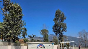 A swimming pool with a clear view of the mountains in the background.