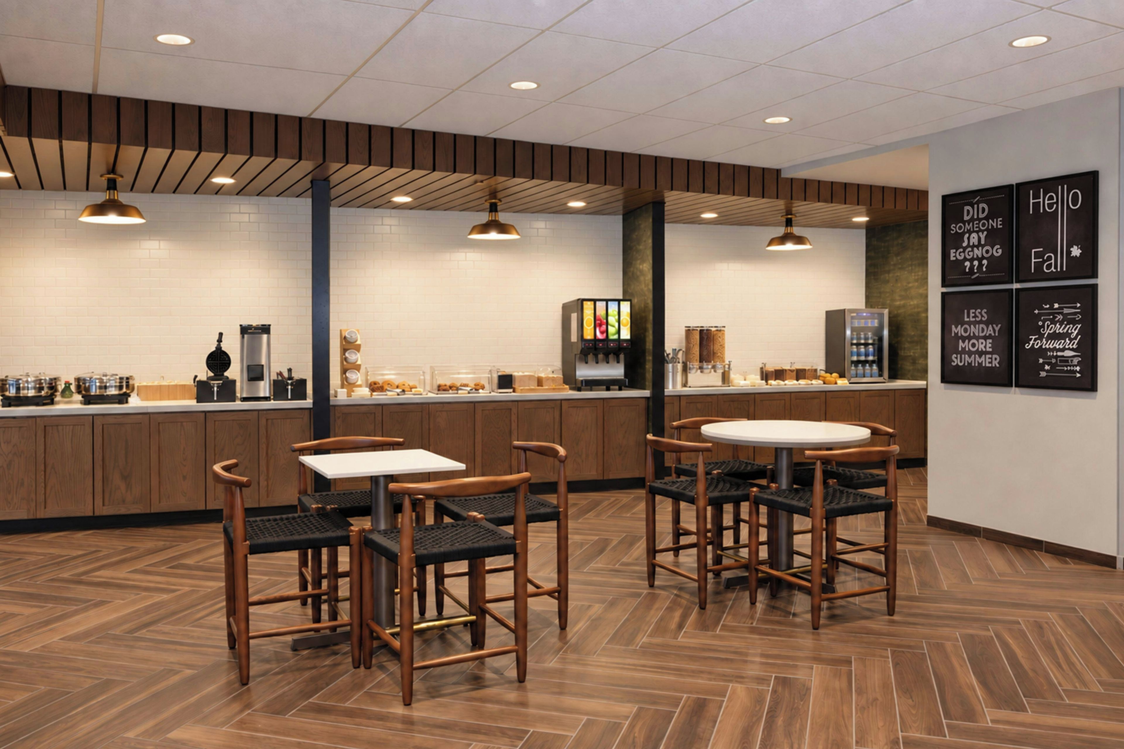 A modern cafe interior with wooden flooring, a central counter, and seating area.
