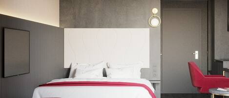 Une chambre d’hôtel moderne avec un grand lit, un fauteuil rouge, un bureau et un téléviseur fixé au mur.