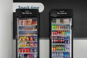 Two vending machines labeled 'Snack time' with a variety of snacks and drinks.