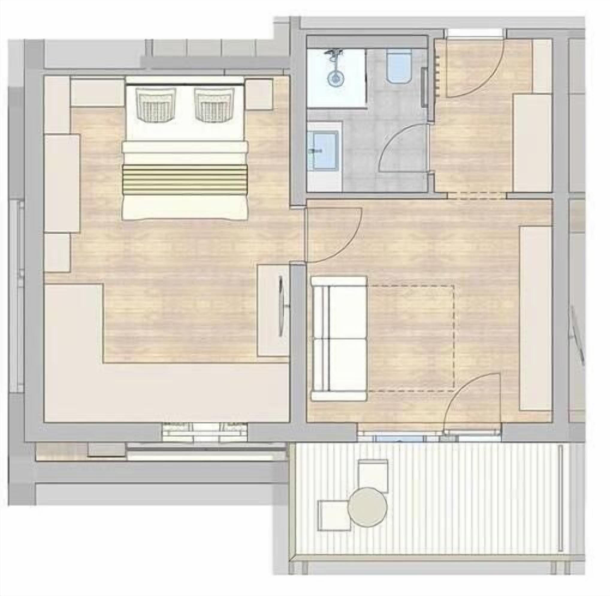 Un plan d’étage comprenant une chambre, une salle de bain et un petit coin salon.
