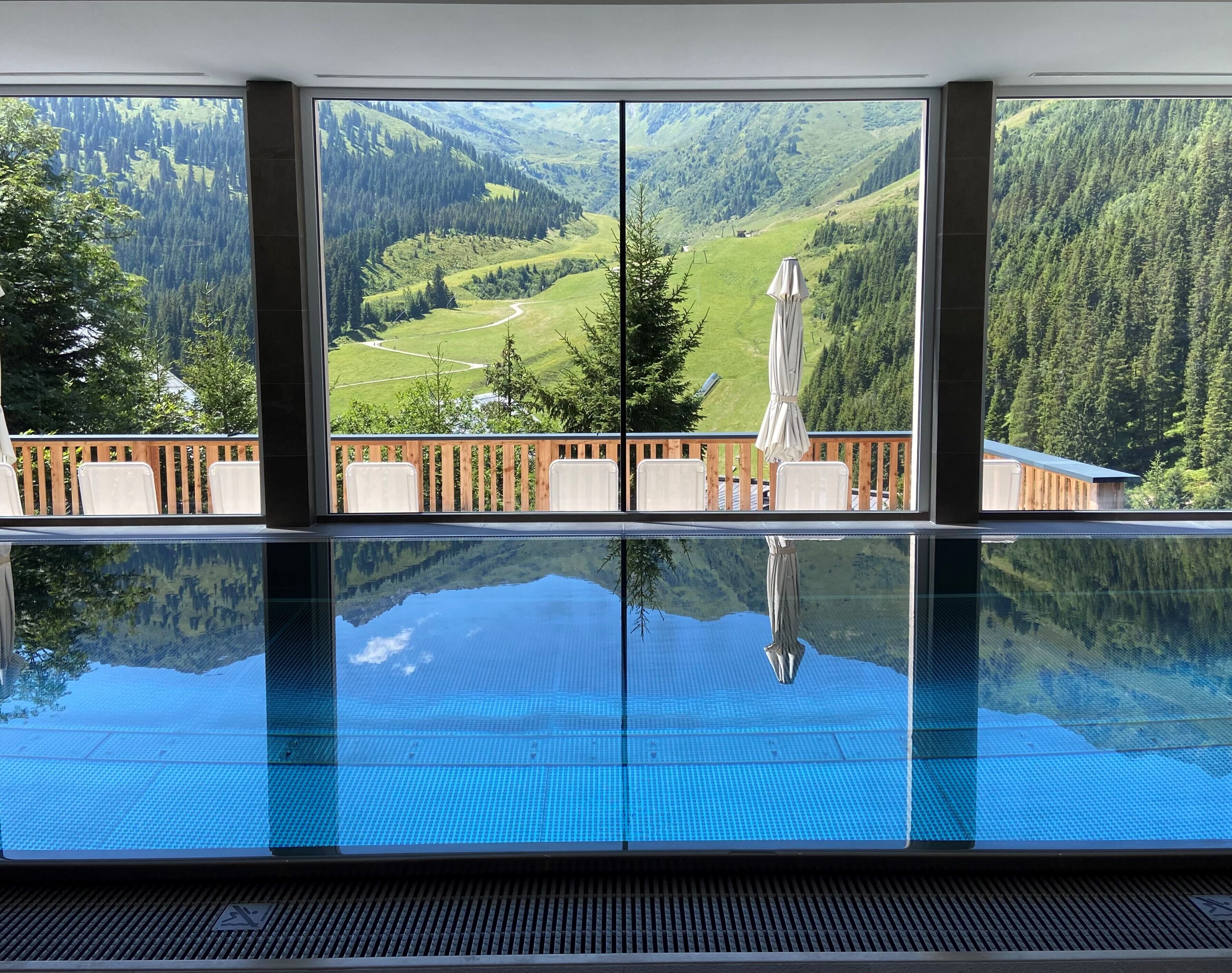 Indoor pool, open 11:00 AM to 7:00 PM, pool umbrellas, pool loungers