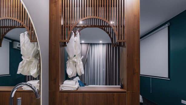 A modern bathroom with a wooden vanity, a large mirror, a bathtub, and a shower area. - Bee Stay Apartment Huy Van (Hanoi)