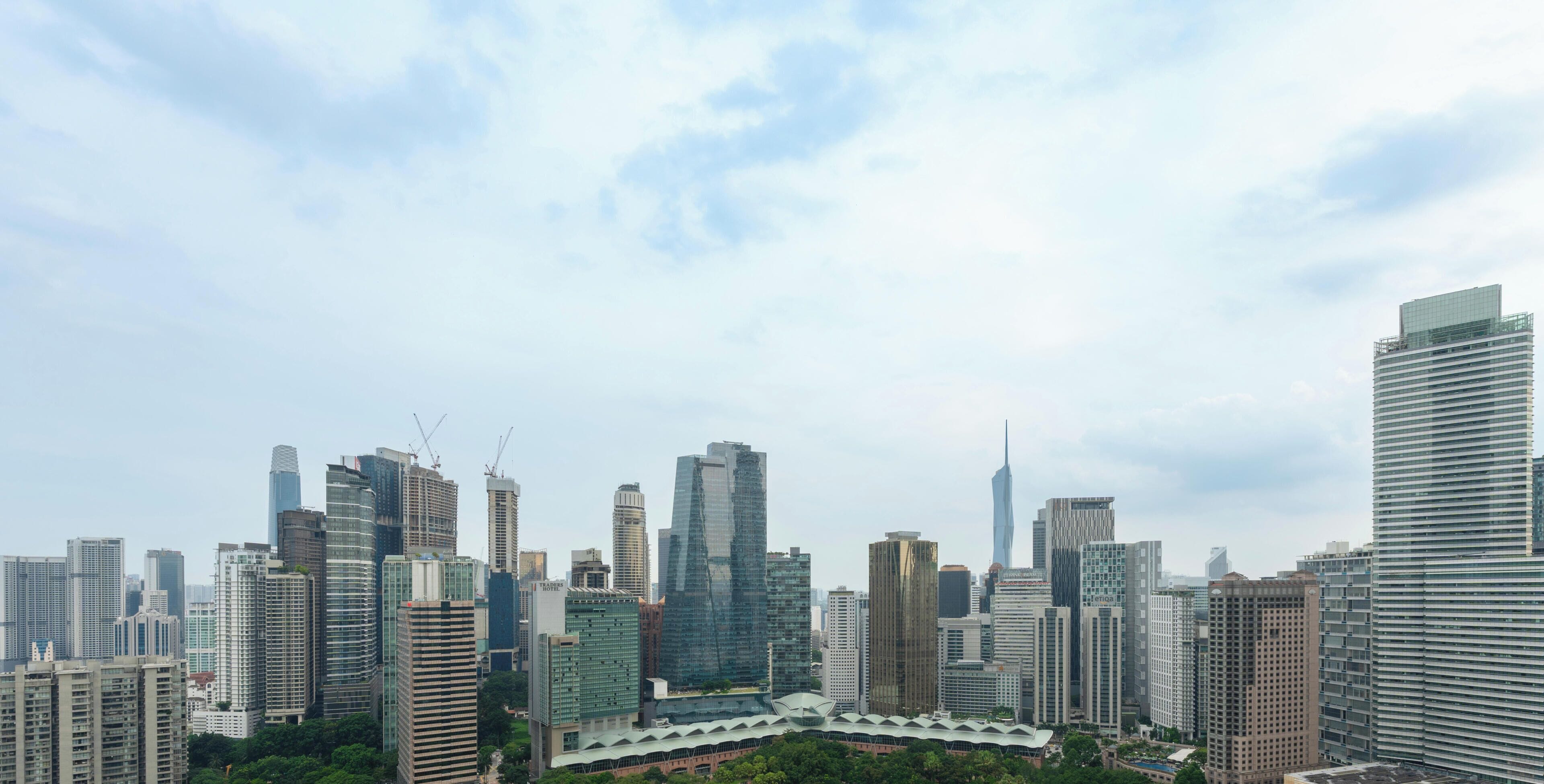 A cityscape with high-rise buildings, including a distinctive skyscraper with a unique design.