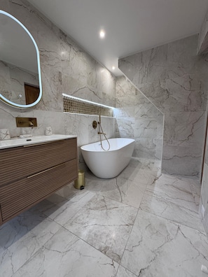 Shower, hair dryer, towels, soap