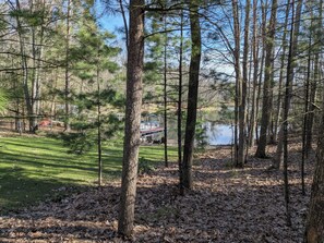 Property grounds - Delightful 1-bedroom cabin on private lake w/AC in Traverse City, pet friendly (Traverse City)