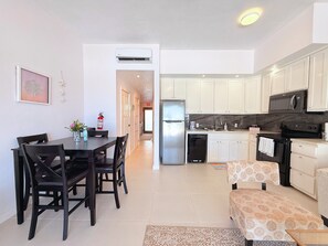 Fridge, microwave, oven, stovetop - 1BR Seashell Suite | Groundfloor@Blue Water Beach (San Pedro)
