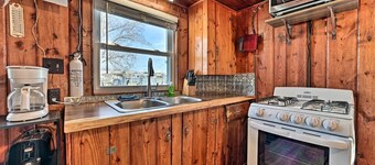 Cozy Lakeside Cabin with Dock & Fire Pit Access in Houghton Lake, Michigan