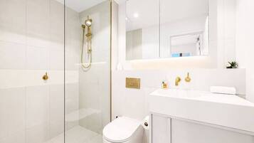 Shower, hair dryer, towels, soap