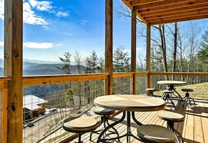 Outdoor dining - Luxurious Sevierville Mountain Retreat • Heated Indoor Pool, Hot Tub & Arcade, Sevierville, TN (Sevierville)