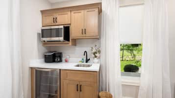 Fridge, microwave, coffee/tea maker, cookware/dishes/utensils
