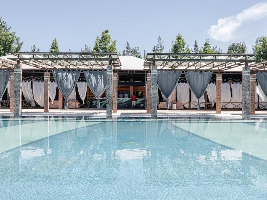 Seasonal outdoor pool, open 10:00 AM to 8:00 PM, free pool cabanas