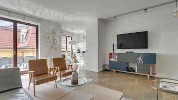 Family Apartment, Balcony, Courtyard View | Living area | 40-inch flat-screen TV with cable channels