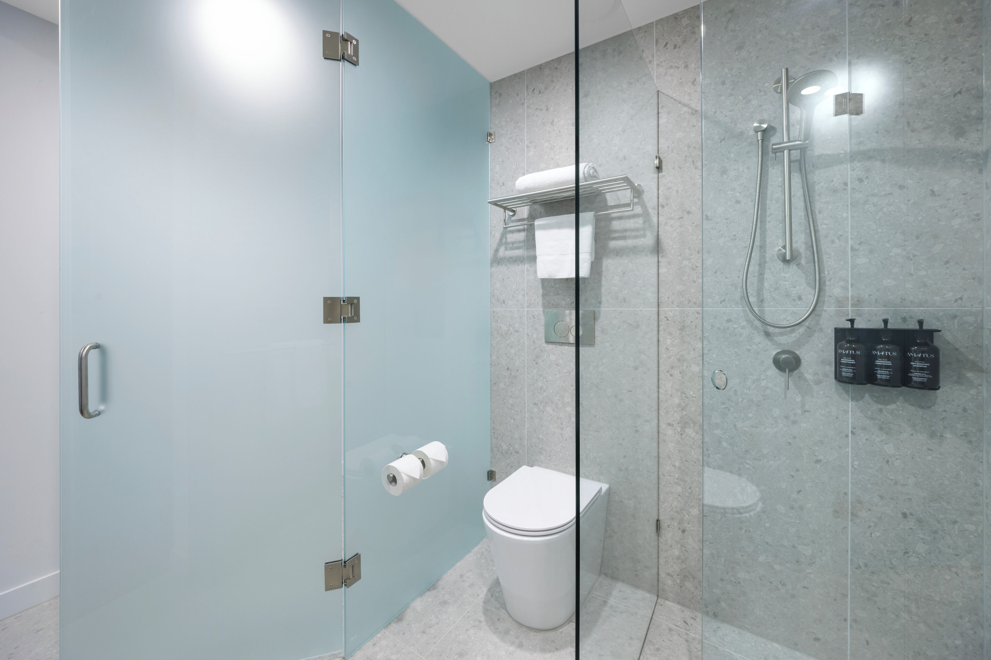 Shower, hair dryer, slippers, towels
