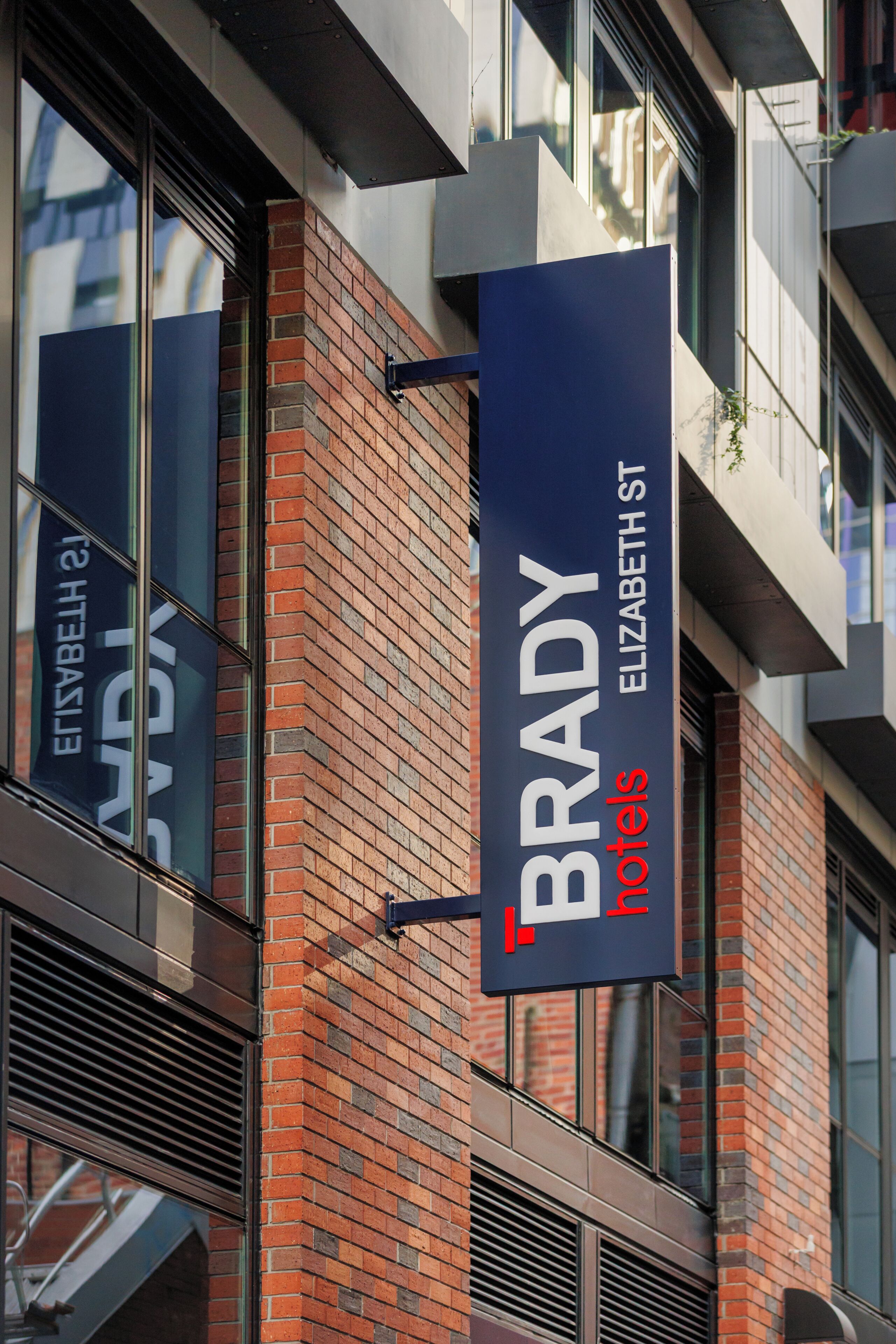 A hotel sign with the name 'BRADY' and 'HOTELS' indicating the establishment.