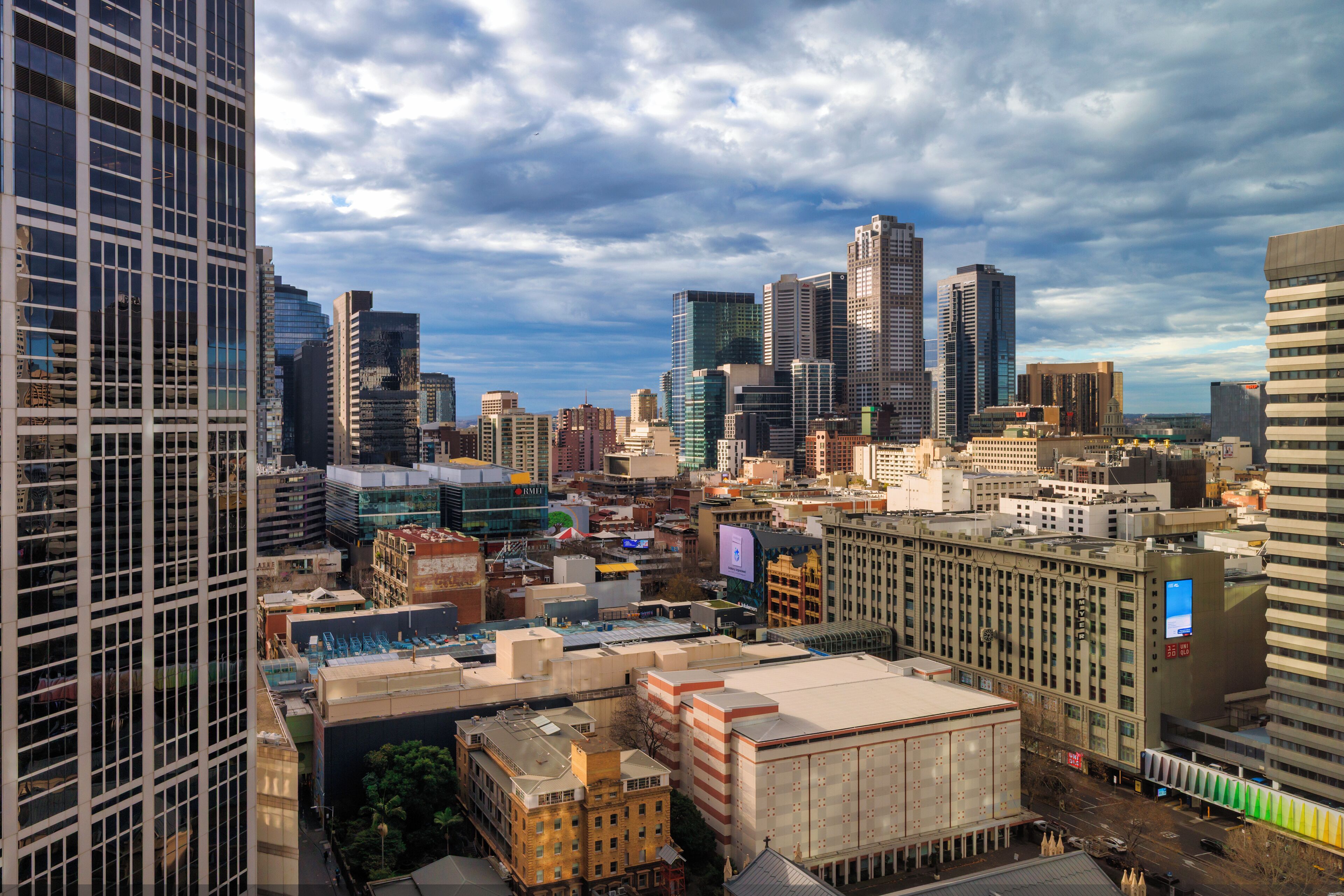A cityscape with a variety of building styles, including modern skyscrapers and older structures.