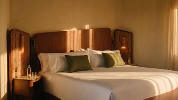 Luxe beddengoed, donzen dekbedden, pillowtop-bedden, een minibar
