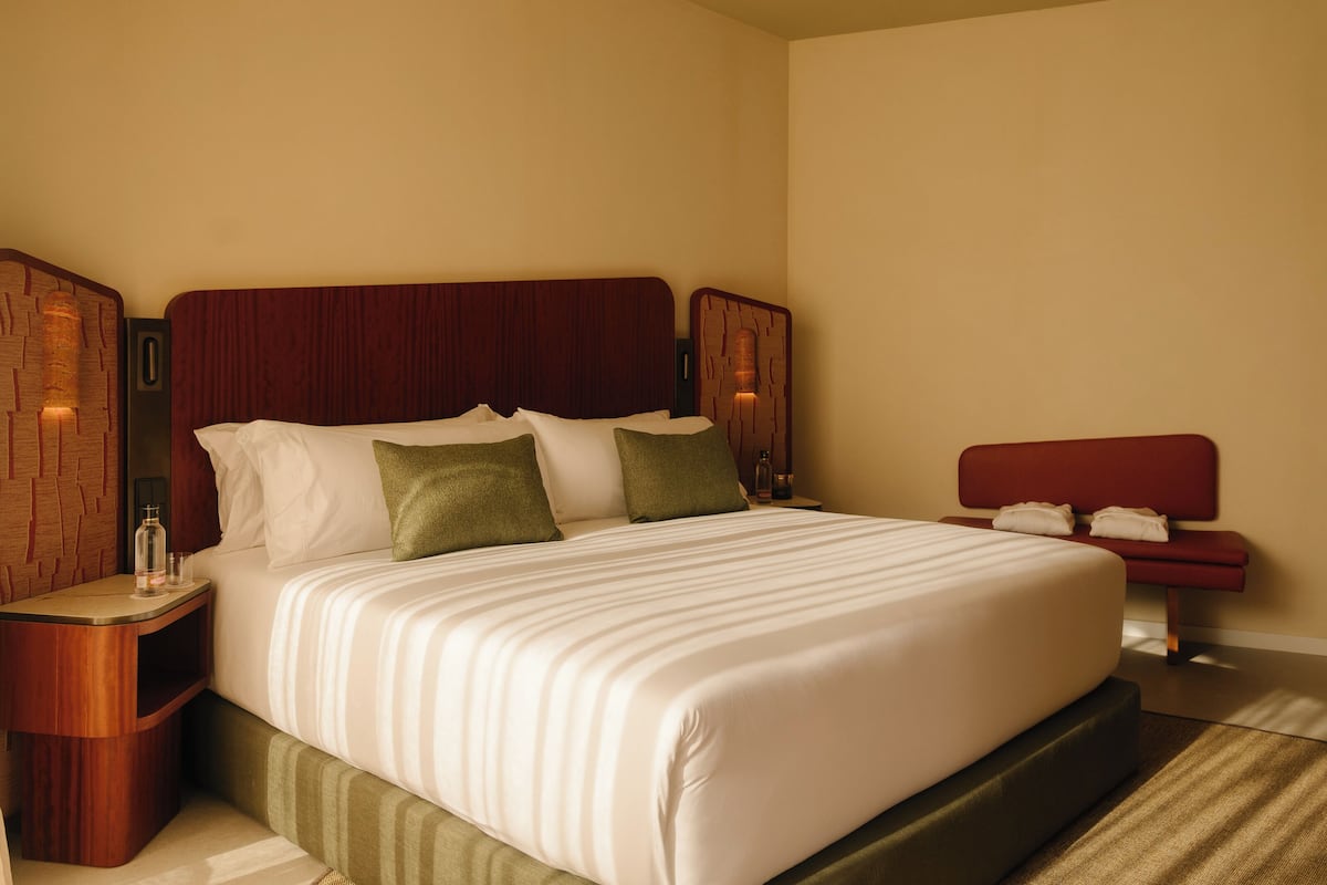 Premium bedding, down comforters, pillowtop beds, minibar