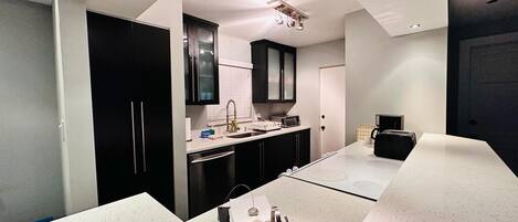 Coffee/tea maker, fridge, microwave, oven