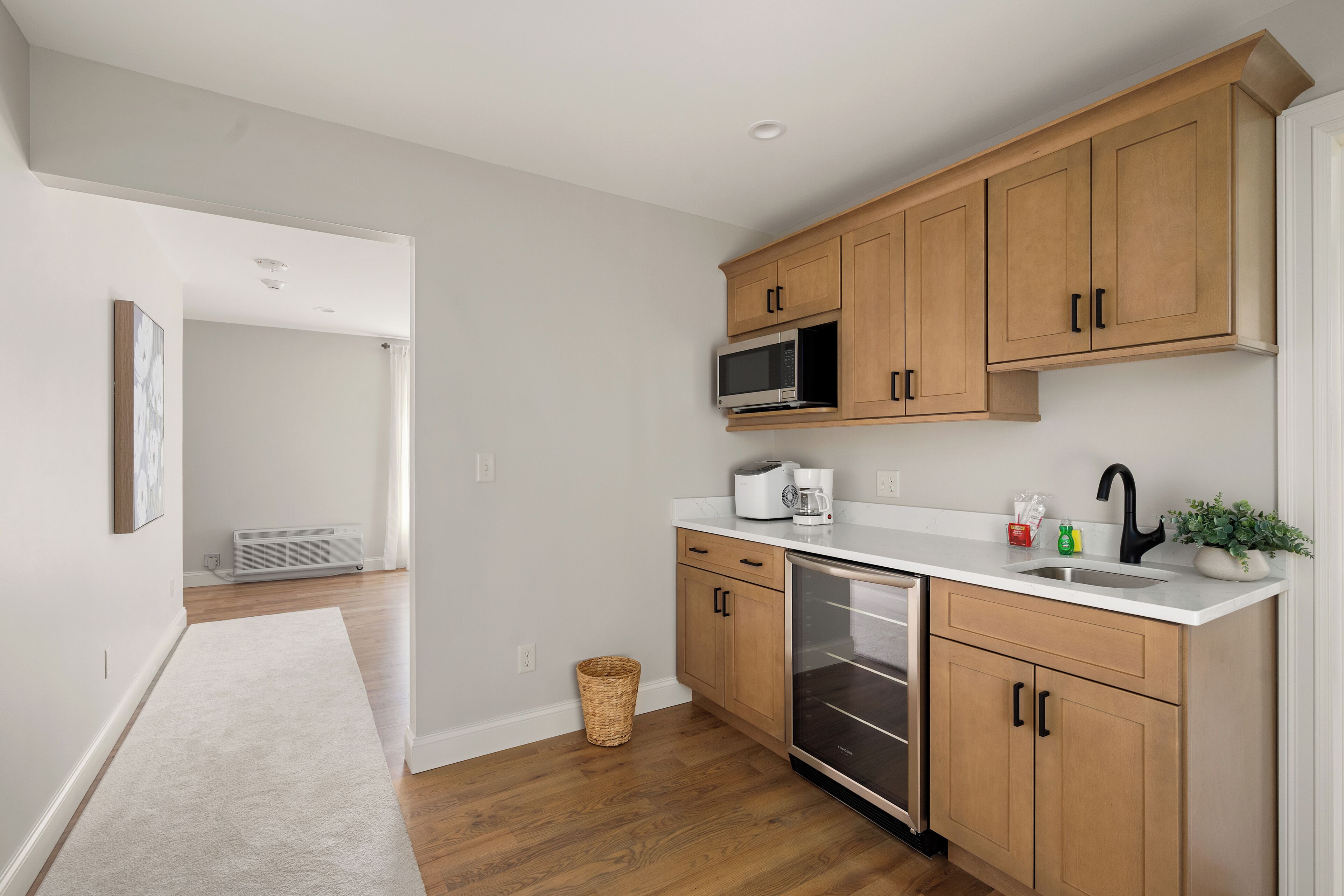 Fridge, microwave, coffee/tea maker, cookware/dishes/utensils