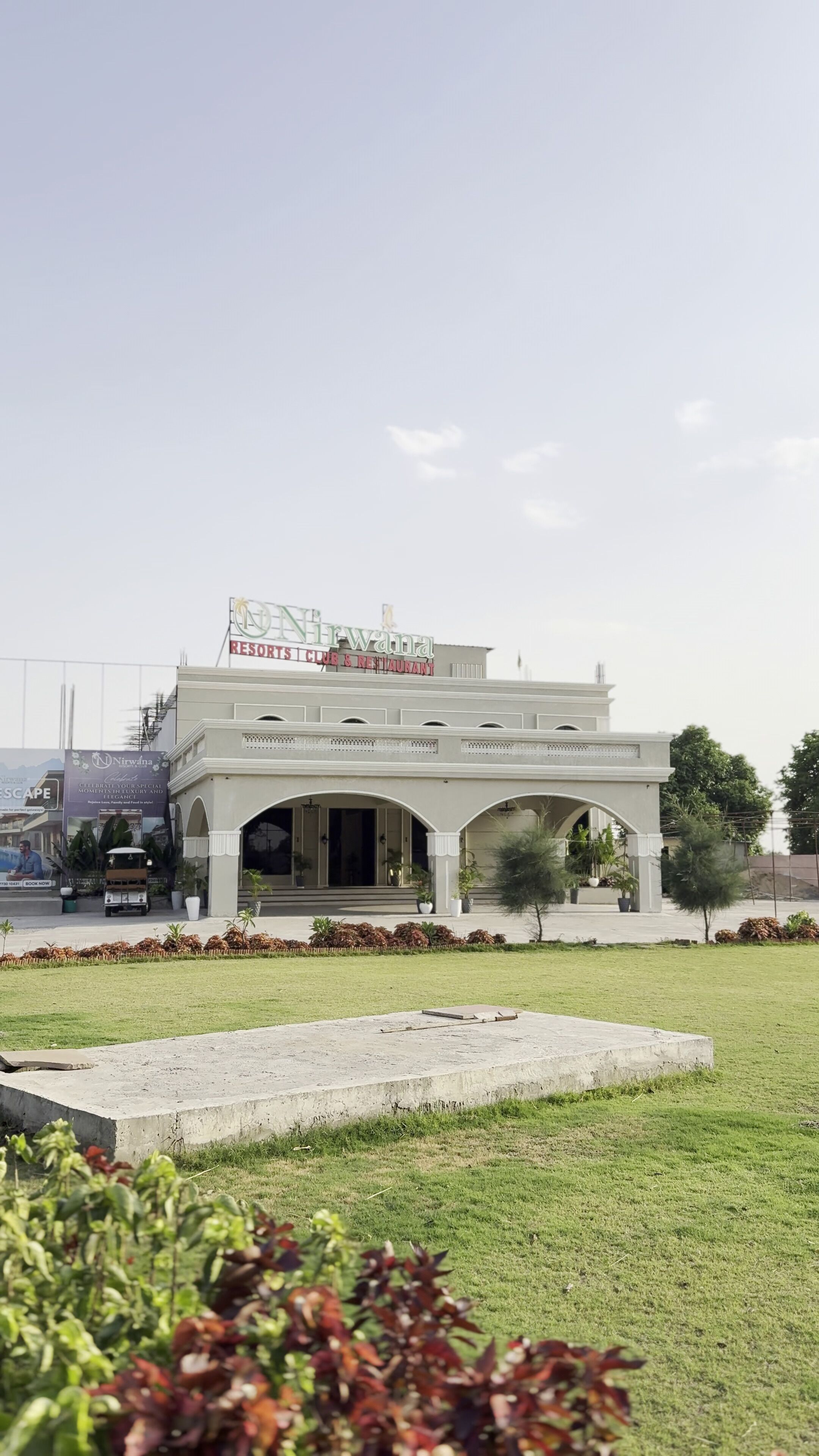 A building with a sign that reads 'Nirvana Restorist Club & Restaurant.'