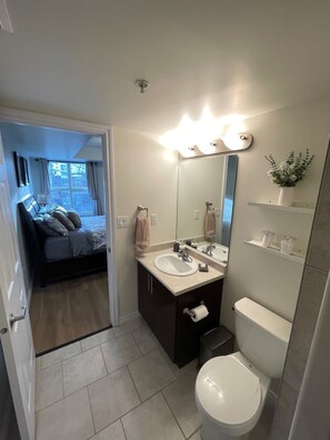 Shower, hair dryer, towels - Cozy Condo Steps To Ice District & Rogers Place (EDMONTON)