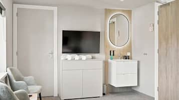 Deluxe Double Room | Living area | 55-inch TV with digital channels