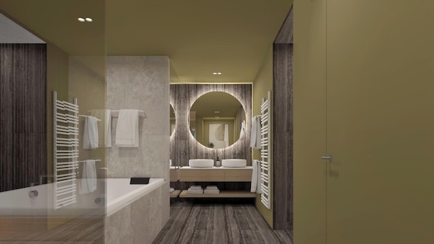 A modern bathroom with a bathtub, two sinks, a large mirror, and a towel rack.