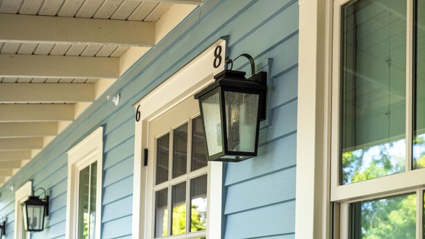 A porch with a door labeled '8' and a window with a number '6' on the wall. - Luxury Boutique Hotel | All 8 Suites | Sleeps 24 | Steps from St. George Street! (St. Augustine)
