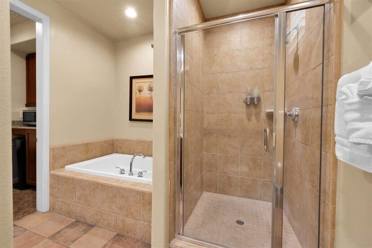 Shower, hair dryer, towels, shampoo