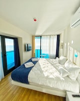 Deluxe Apartment, Sea View | Premium bedding, pillowtop beds, blackout drapes, iron/ironing board