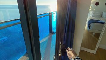 Deluxe Apartment, Sea View | Premium bedding, pillow-top beds, blackout curtains, iron/ironing board