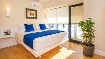 Premium bedding, pillow-top beds, blackout curtains, iron/ironing board