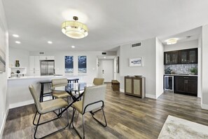 A modern kitchen with dark cabinets, a white countertop, and a built-in oven. - Updated 2BR/2BA Isla Del Sol Condo with Golf Course Views & Pool Near St. Pete Beach (Isla Del Sol)
