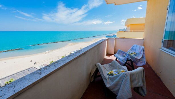A balcony with a view of the beach and ocean. - GuestHost - Sea View Europa Apartment (Montesilvano)