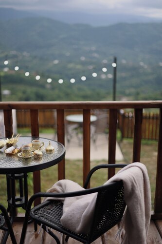 a cozy house with a beautiful view of the mountains