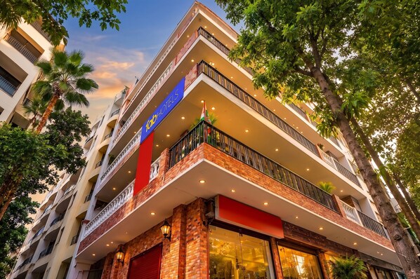 A multi-story hotel with balconies, a red awning, and a sign for 'Hotel'. - Fabhotel Mohan Villa (New Delhi)