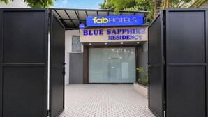 A hotel entrance with a sign for 'fabHOTELS BLUE SAPPHIRE RESIDENCY'. - Hotel New Blue Sapphire Residency (Mumbai)