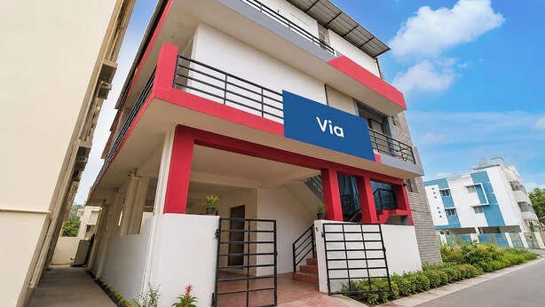 A multi-story building with a prominent 'Via' sign, a staircase, and a gated entrance. - Via Zane - Nr Coimbatore International Airport (Coimbatore)