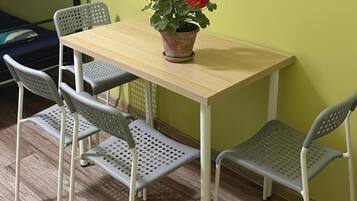 Standard Quadruple Room, City View | Dining