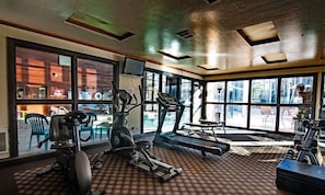 A gym with exercise equipment, large windows, and a view of the outside. - Swimming Pool, Views, Studio suite in beautiful Brian Head, Utah (Brian Head)