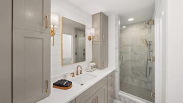 Shower, hair dryer, towels, shampoo