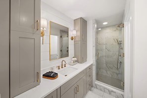 Shower, hair dryer, towels, shampoo