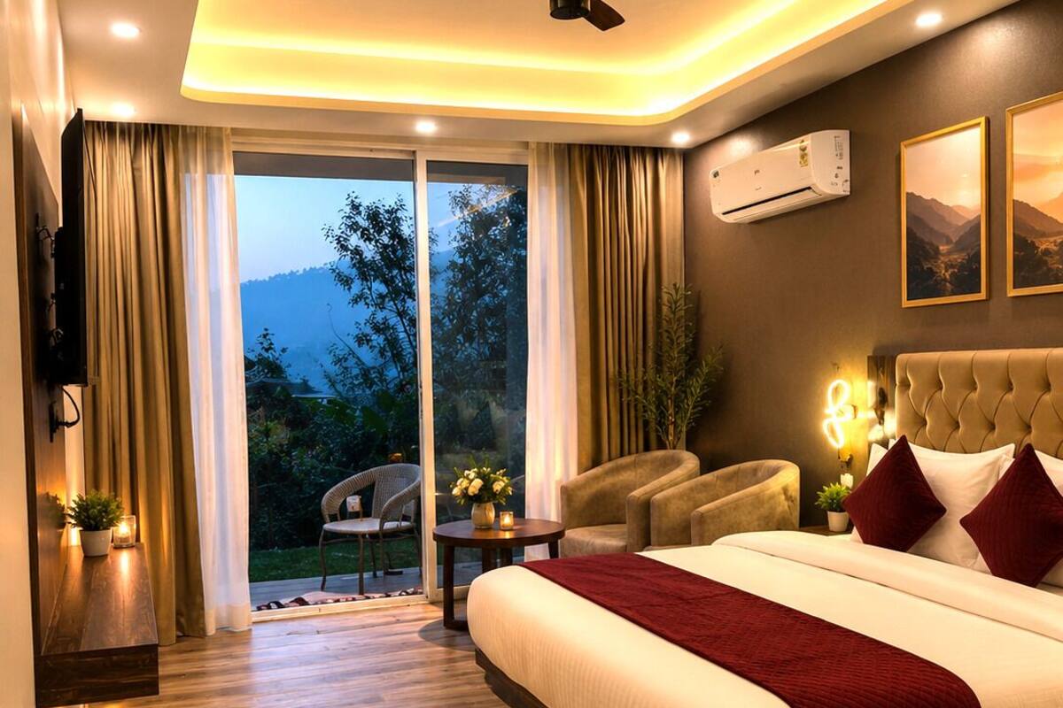 A modern bedroom with a large bed, a ceiling fan, an air conditioning unit, a TV, and a view of the outdoors.
