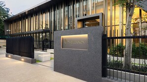 A modern building with a sign reading 'THE LENNOX.' - One Bedroom Apartment at The Lennox (Accra)