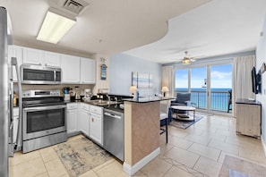 Condo, 1 Bedroom, Ocean View (1705E) | Private kitchen | Full-size fridge, microwave, oven, stovetop - Calypso Beach Resort Tower 1 (Panama City Beach)