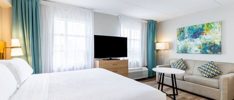 Tabla de planchar con plancha, wifi gratis y ropa de cama