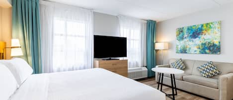 Tabla de planchar con plancha, wifi gratis y ropa de cama