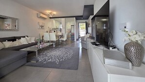 A modern living room with a sofa, coffee table, and a decorative rug. - Groundfloor, oasis beach VI la zenia (La Zenia)
