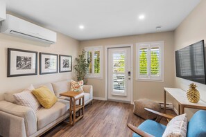 Living area - Brand new 1BR retreat with lake views, patio, near wineries & beaches (Kelowna)